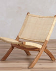 Alta™ woven rattan and teak folding lounge chair