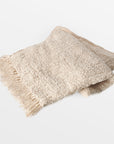 Capri Cotton Throw - natural Color | Image 1 | From the Capri Collection | Masterfully assembled with natural cotton for long lasting use | Available in natural color | texxture home