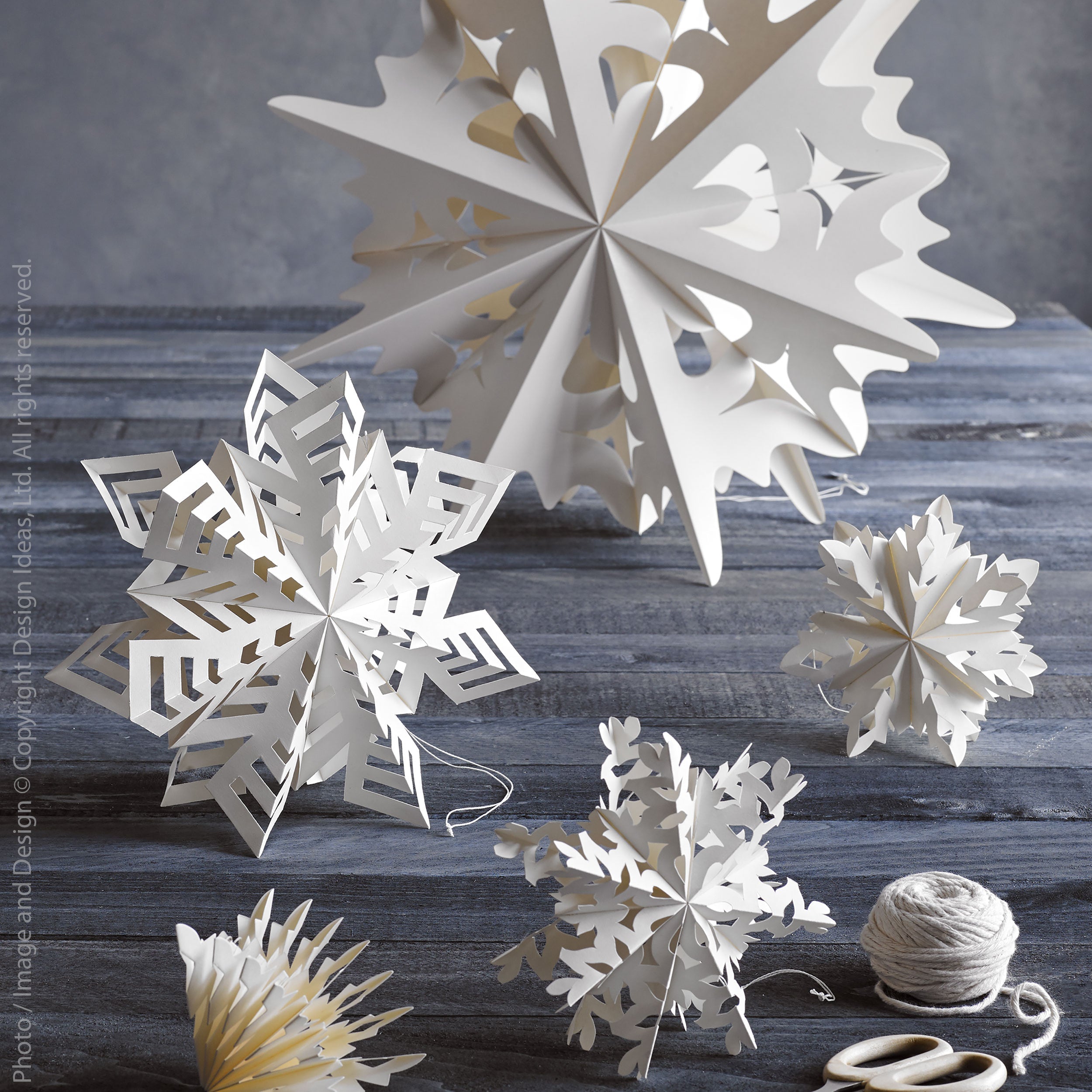 Flurry Paper Snowflake Tinsel (Small) White Color | Image 2 | From the Flurry Collection | Masterfully assembled with natural paper for long lasting use | Available in natural color | texxture home
