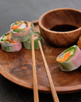 Chiku Teak Chopsticks Natural Color | Image 2 | From the Chiku Collection | Masterfully assembled with natural teak for long lasting use | These utensils are sustainably sourced | Available in natural color | texxture home
