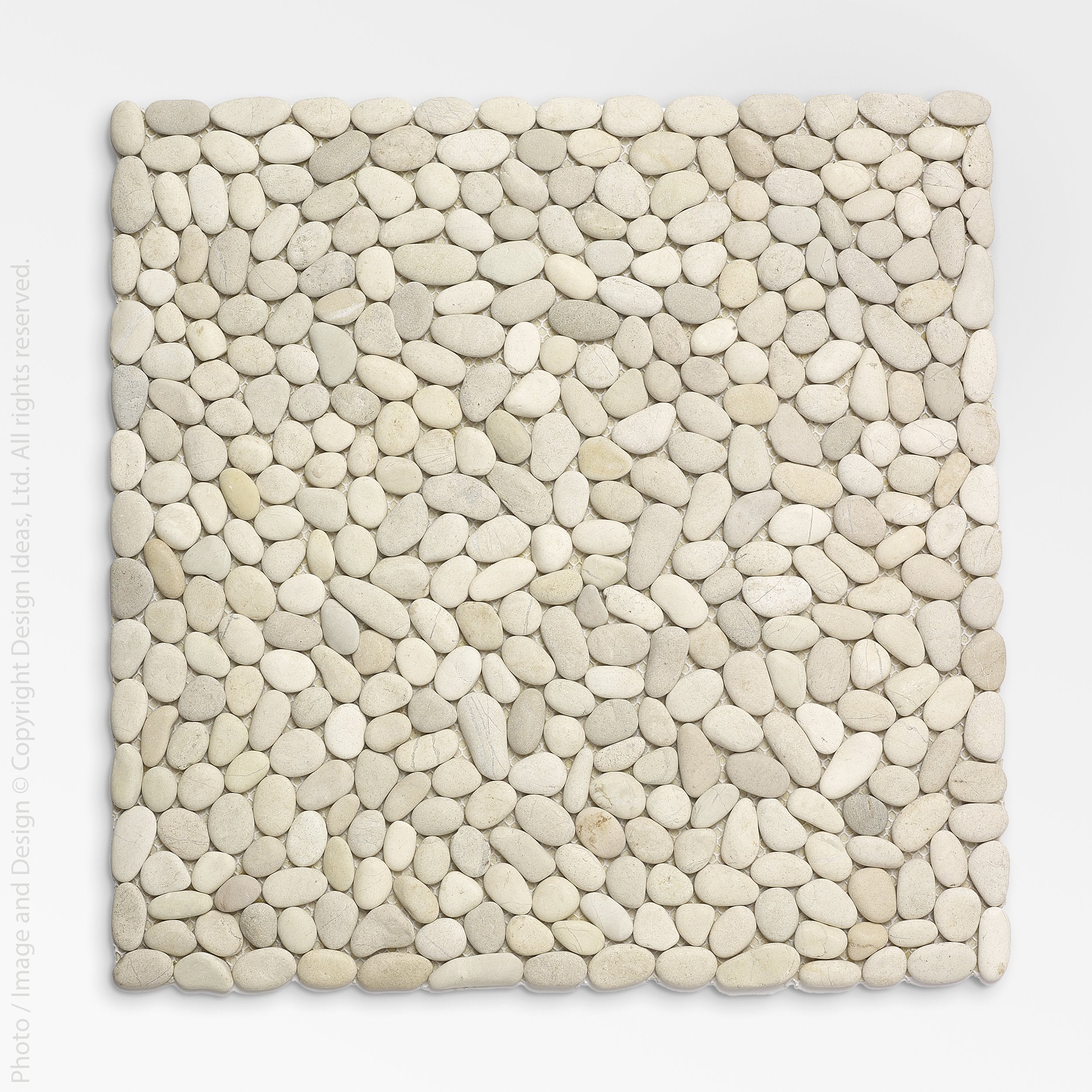 Beachstone Stones Placemat - Natural color | Image 1 | From the BeachStone Collection | Masterfully created with natural stones for long lasting use | Available in white color | texxture home