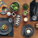 Stoneshard™ plate (11.8 dia x 0.5 in.) - Gray | Image 2 | Premium Plate from the Stoneshard collection | made with Riverstone for long lasting use | texxture