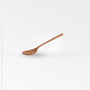Chiku Teak Spoon - Natural Color | Image 1 | From the Chiku Collection | Skillfully made with natural teak for long lasting use | These utensils are sustainably sourced | Available in natural color | texxture home