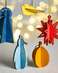 Festive Penguin 3D Wood Ornament Green Color | Image 2 | From the Festive Collection | Expertly constructed with natural wood for long lasting use | Available in white color | texxture home